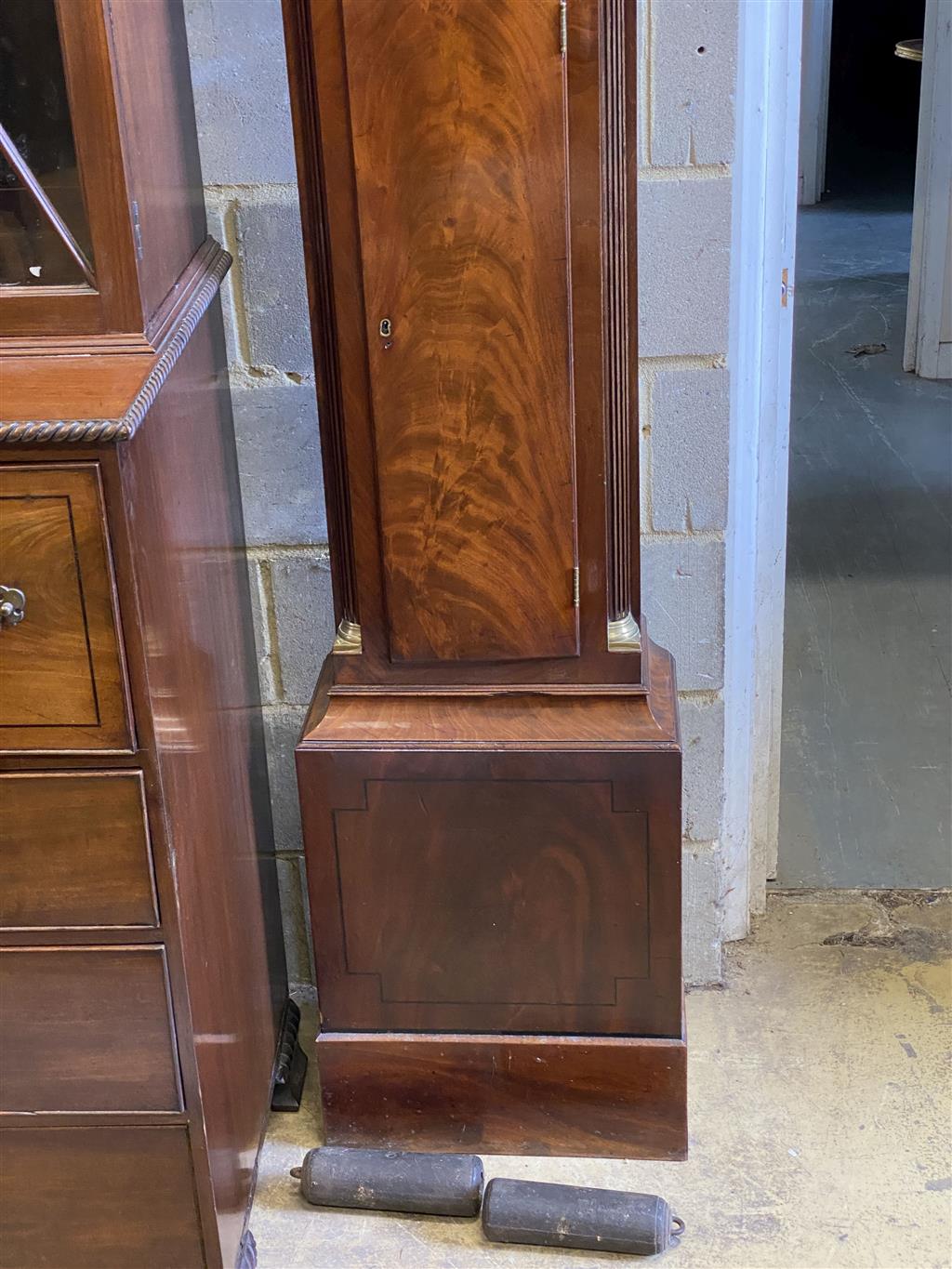 E. Buckwell, Brighton. A late 18th century mahogany eight day longcase clock, with painted arched dial, height 222cm